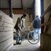 Chicago resident Rex McMurry lifts a bike at the Ann Arbor Classic Bicycle Show on Sunday, April 28. Daniel Brenner I AnnArbor.com